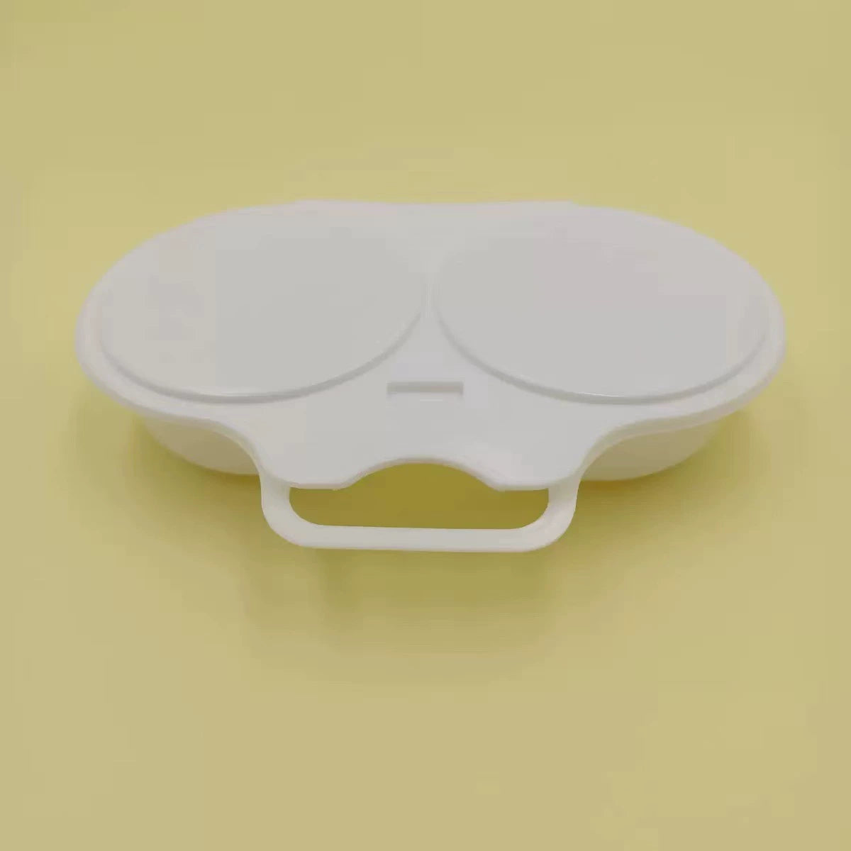 Compact white maker with its lid closed